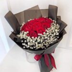 Elegant Red Roses & Baby’s Breath Bouquet in Midnight Wrap